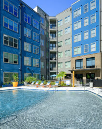 Resort style pool surrounded by lounge chairs