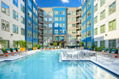 Resort style pool surrounded by lounge chairs