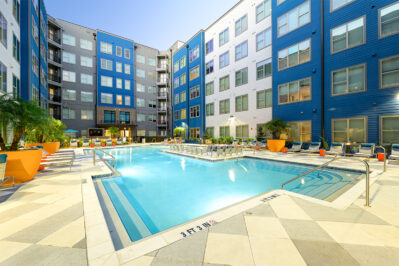 Resort style pool surrounded by lounge chairs