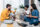 Young adults sitting on the floor in an apartment